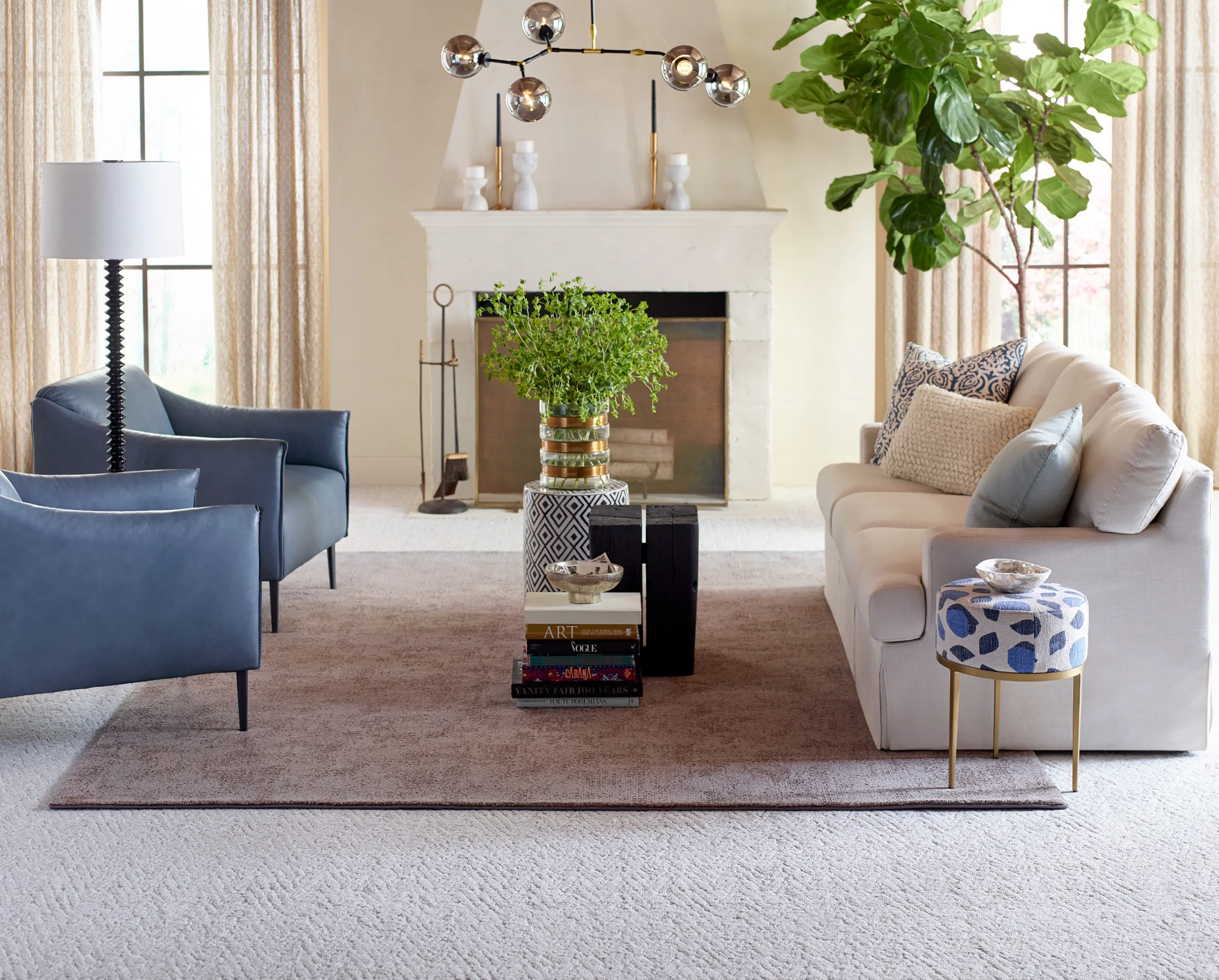 Mediterranean-style custom rug over broadloom carpet