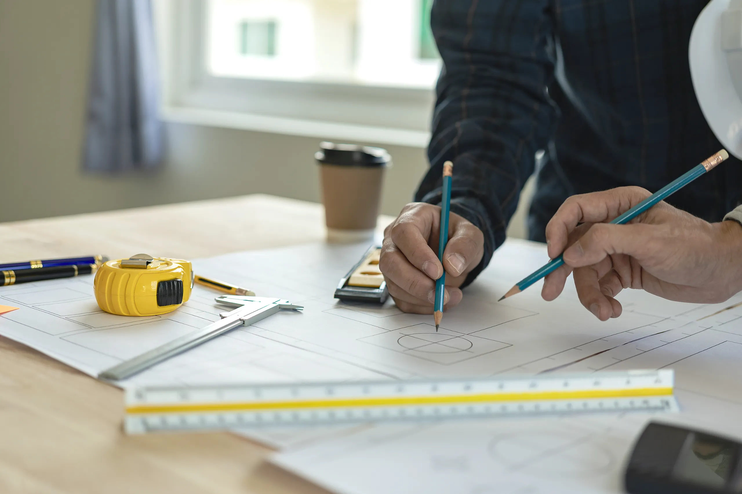 Builder reviewing flooring plans and material samples